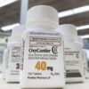 White prescription bottles of OxyContin extended-release tablets available to Order OxyContin online legally.