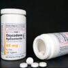 Bottles and tablets of Oxycodone hydrochloride for secure Oxycodone pain relief UK.