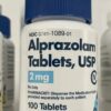 An official pharmaceutical bottle displaying a valid medical prescription label for alprazolam tablets, representing a secure avenue to find legitimate Xanax for sale.